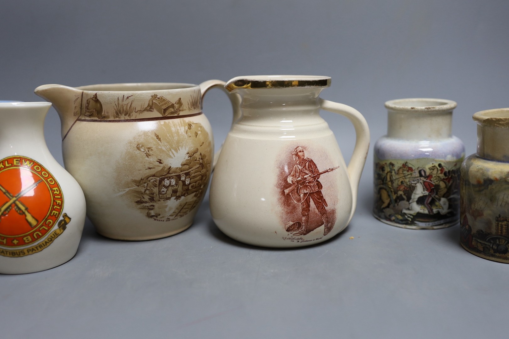 Crimean, Boer war, WWI and shooting commemorative ceramics - including Pratt ware pots, a gentleman in khaki jug and saucer, a rifle contest Wimbledon 1865 pot lid, a Goss Hendon and Cricklewood rifle club vase etc.